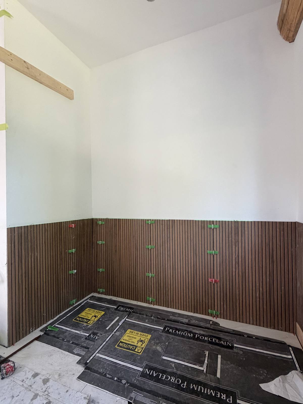 Accent wall wood-look slat tile — during install