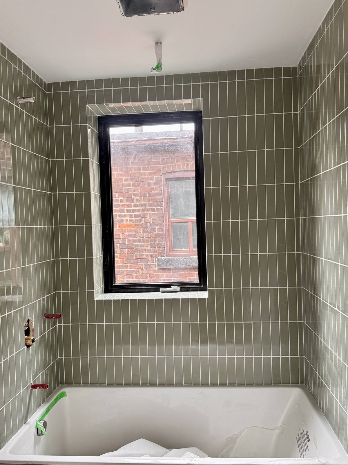 Bathroom green stacked tile — after