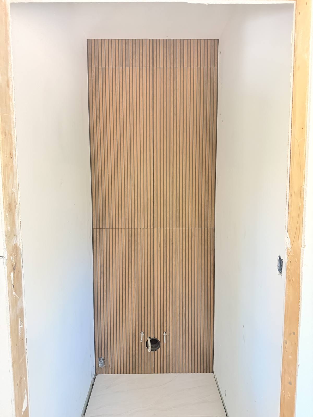 Powder room wood slat feature wall — after