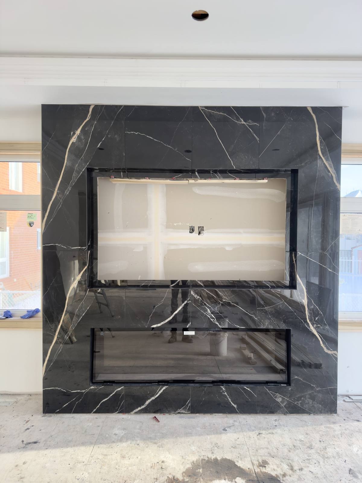 Fireplace black marble feature wall — after